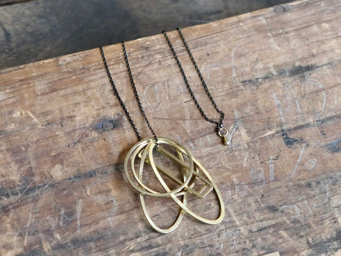 Six Brass Geometric Shapes Necklace