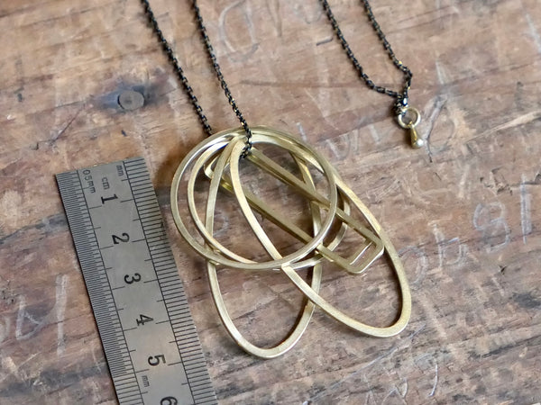 Six Brass Geometric Shapes Necklace