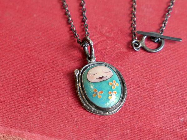 Turquoise Sleeping Baby Pendant with Snakes and Flowers