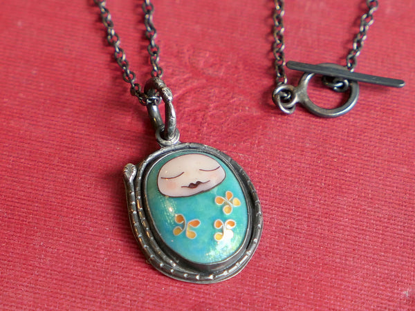 Turquoise Sleeping Baby Pendant with Snakes and Flowers